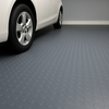 Black studded penny-dot pattern rubber flooring roll, providing non-slip, heavy-duty matting for garages and workshops. 