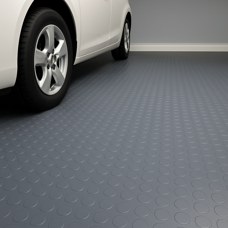 Black studded penny-dot pattern rubber flooring roll, providing non-slip, heavy-duty matting for garages and workshops. 