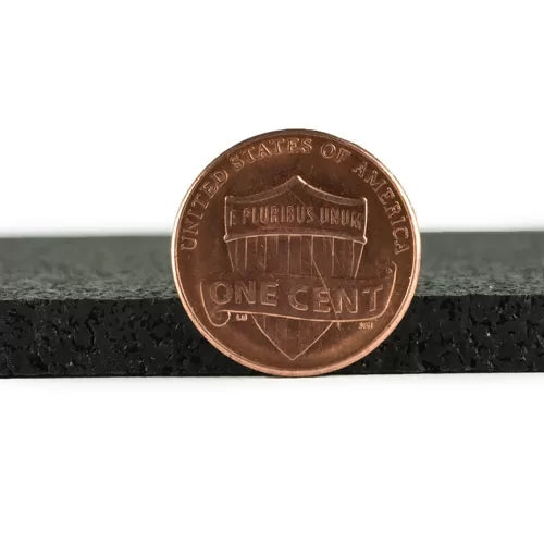 Rubber Acoustic Underlay – Up to 54 dB Impact Noise Insulation 3mm, shown with a penny for scale on textured foam, highlights its slim design for effective soundproofing and acoustic insulation in limited spaces.