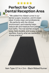 Testimonial graphic showing ribbed non-slip rubber runner in dental reception area; chair and plant by the wall; review highlights clean appearance and dirt-trapping performance for busy practices.