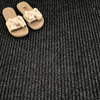 Close-up of anthracite triple-ribbed polypropylene barrier matting surface — 5.5mm pile height, 950g/m² weight