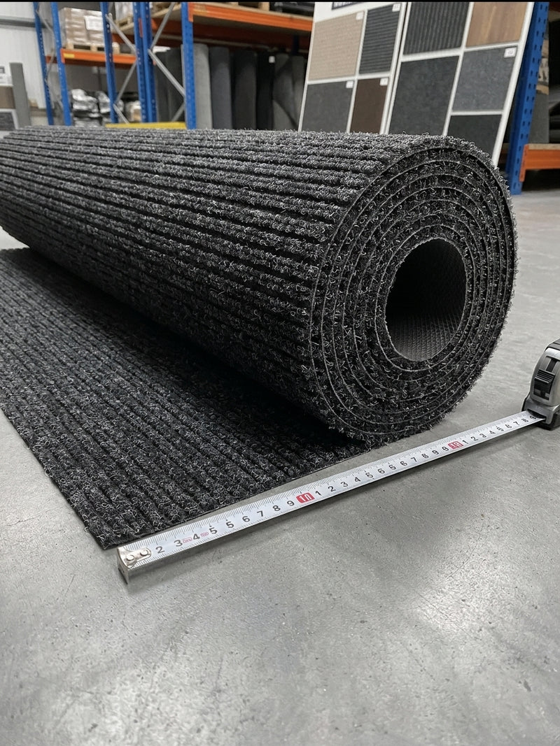 Anthracite polypropylene barrier entrance matting commercial roll — clean cut edge, no black binding, triple-ribbed surface, ready to cut to length