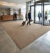 Beige barrier matting installed in UK hotel reception — clean straight edges, no binding tape, light neutral colour
