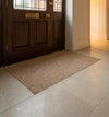Beige barrier entrance matting in recessed matwell at luxury UK residential entrance — flush-fit polypropylene mat, light neutral tone