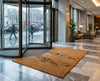 Natural coir entrance matting at UK hotel lobby entrance — 17mm heavy duty coconut fibre mat with PVC backing