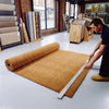 Natural coir matting roll being cut to size — available in 1m and 2m widths up to 12m full roll