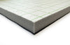 Cross-section of 12mm memory foam carpet underlay showing thick foam layer, DPM membrane backing and top surface — 49dB sound reduction, 3.5 TOG