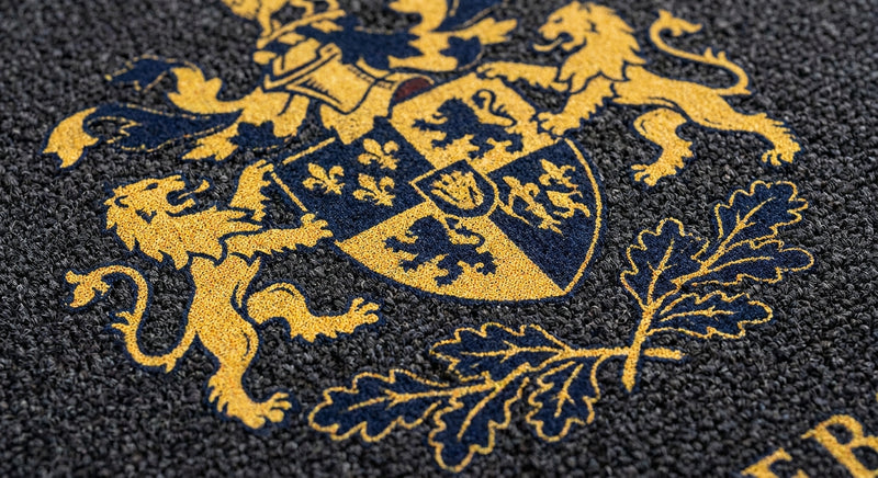 Close-up of custom logo mat print quality — photographic digital dye-sublimation printing, pin-sharp detail on mat fibre, unlimited colours