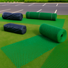 Heavy-duty grass protection mesh rolls on lawn; green reinforced turf mat suitable for car parks, driveways and lawns.
