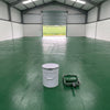 Mid green floor paint in an agricultural workshop with the roller door open to fields, 20 litre tin and roller
