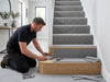Memory foam carpet underlay being fitted to staircase in UK home — 12mm thick PU foam on stair treads before carpet installation
