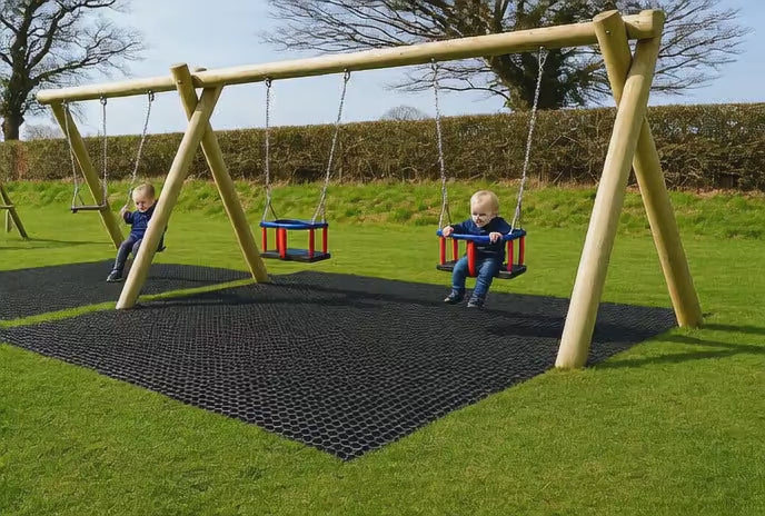 Video showing children playing on swings over Slip-Not rubber grass mats in a playground.