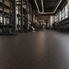 Black rubber gym matting with red speckle installed in commercial weight room UK — Slip-Not 8mm rolls