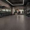 Black rubber gym flooring installed in UK personal training studio — Slip-Not heavy duty matting rolls